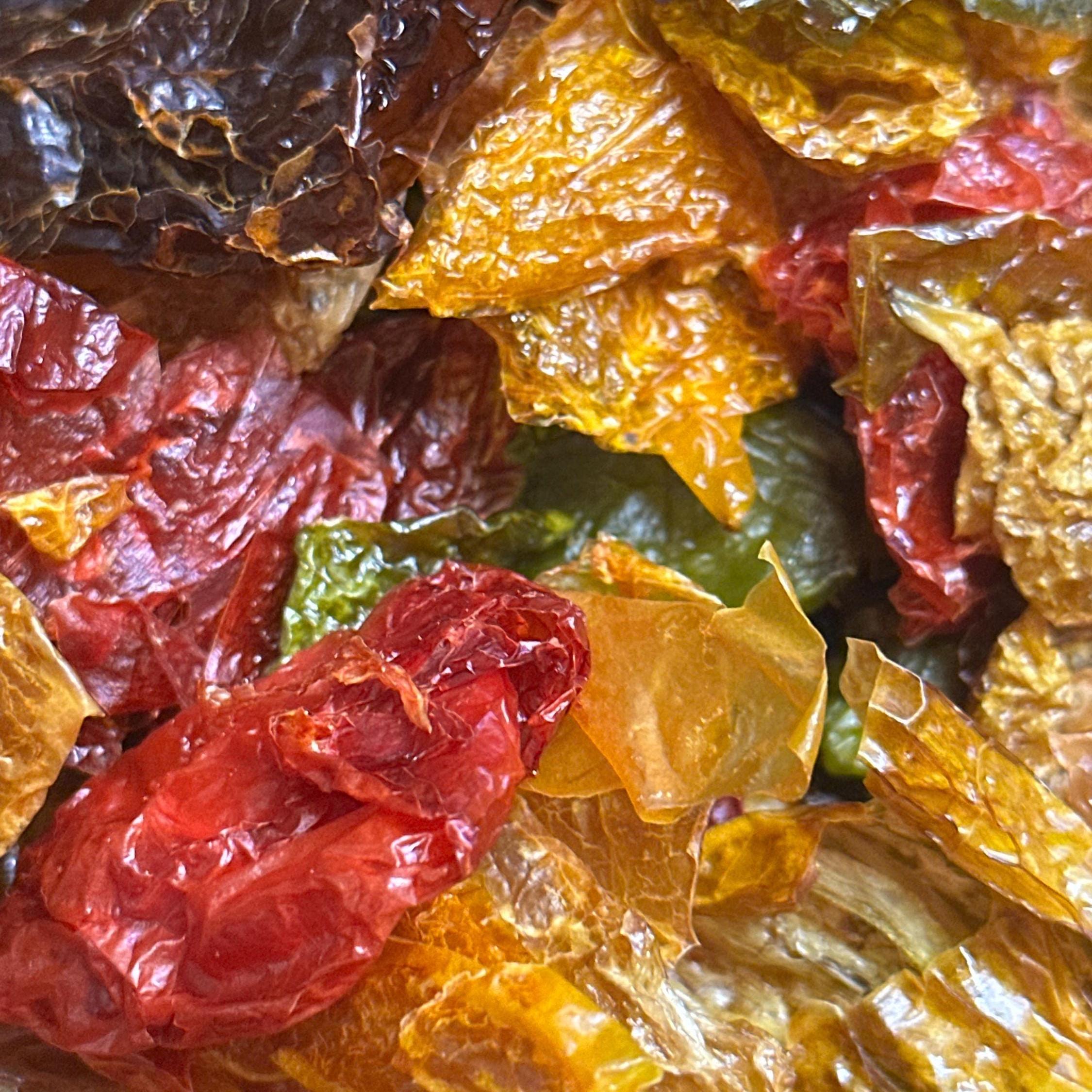 Mike’s Pepper Seeds Close-up of dried red, yellow, and green Peppers.